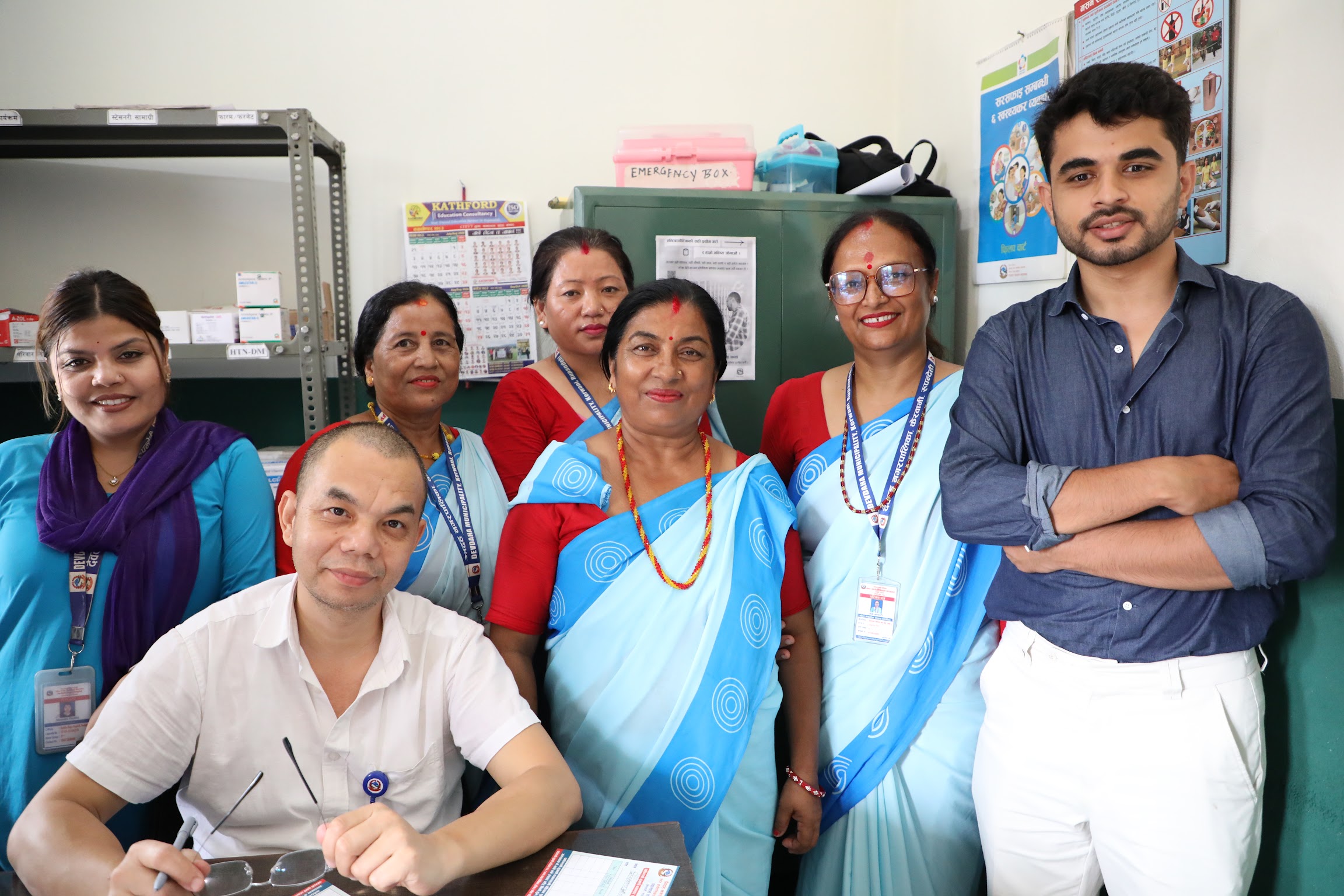 Programme team members and local health workers together at the health facility.